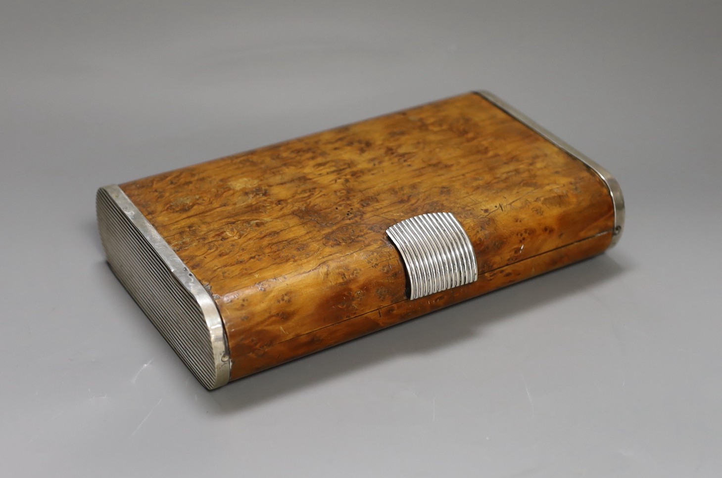 A Zendrini of Torino Art Deco style 800 standard white metal mounted burr yew cigar case.